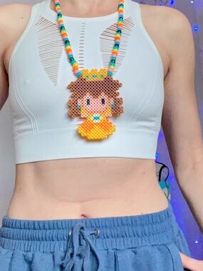 Nintendo princess daisy — yellow —beaded character Mario necklace — black light